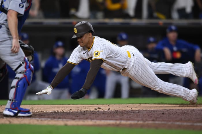 Padres Juan Soto dives for home base